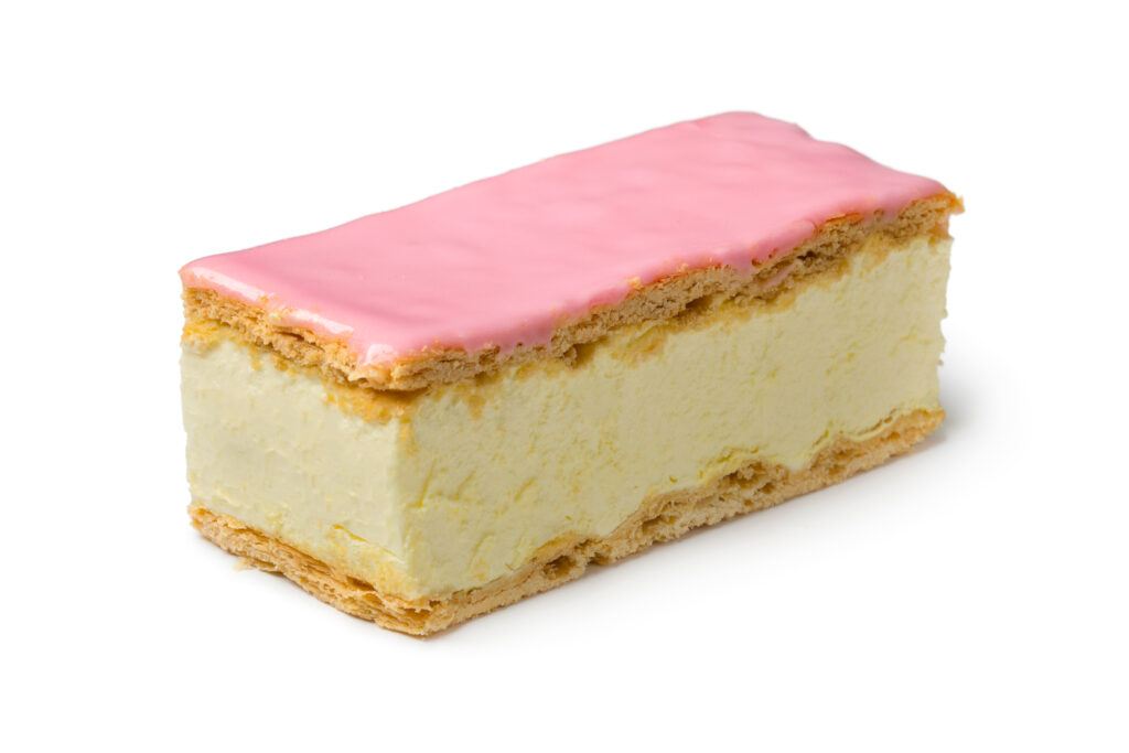 Single,Tompouce,Pastry,With,Pink,Icing,Close,Up,Isolated