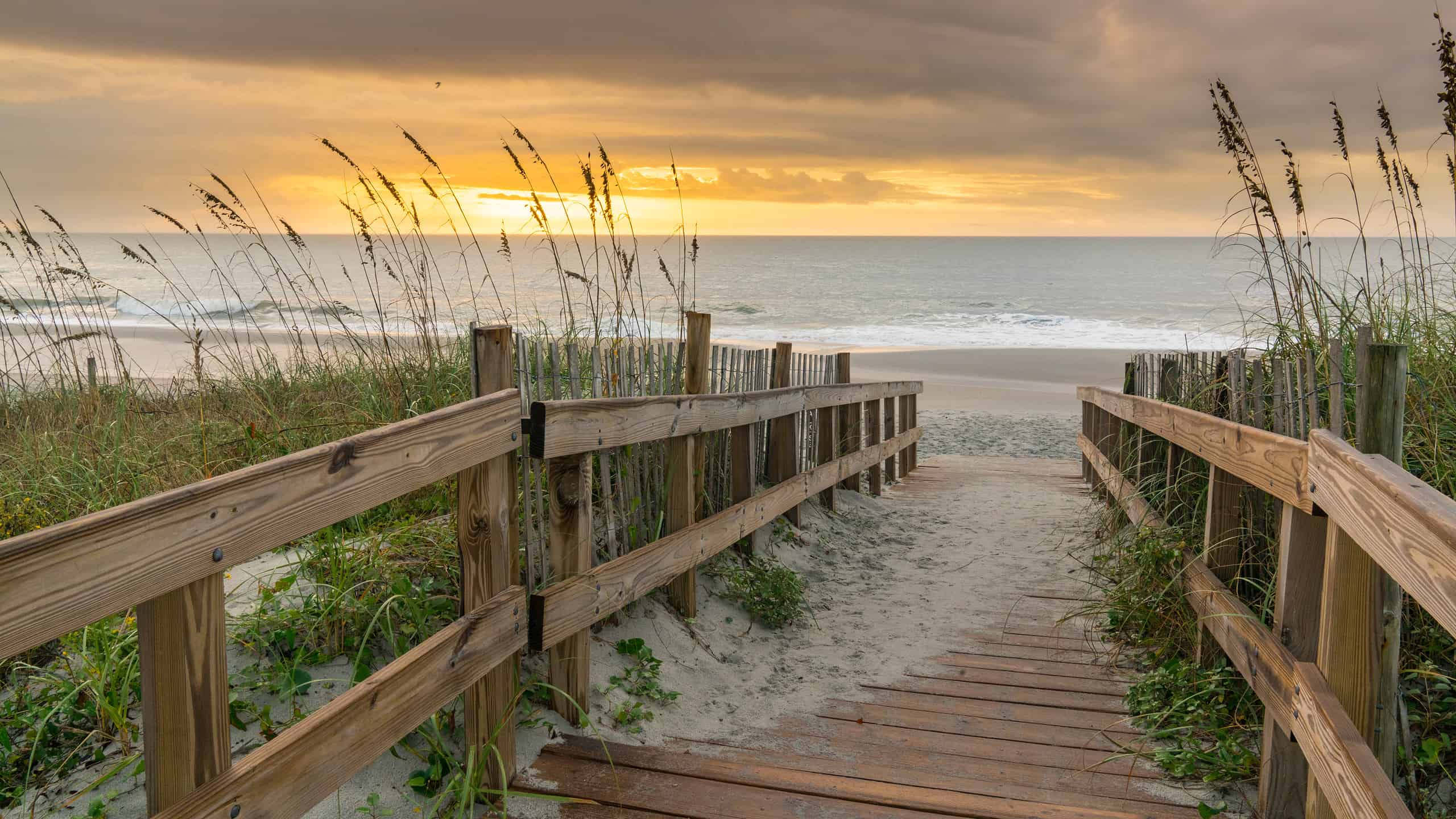 Sunrise along boardwalk over a sand dune in Myrtle Beach, South Carolina
