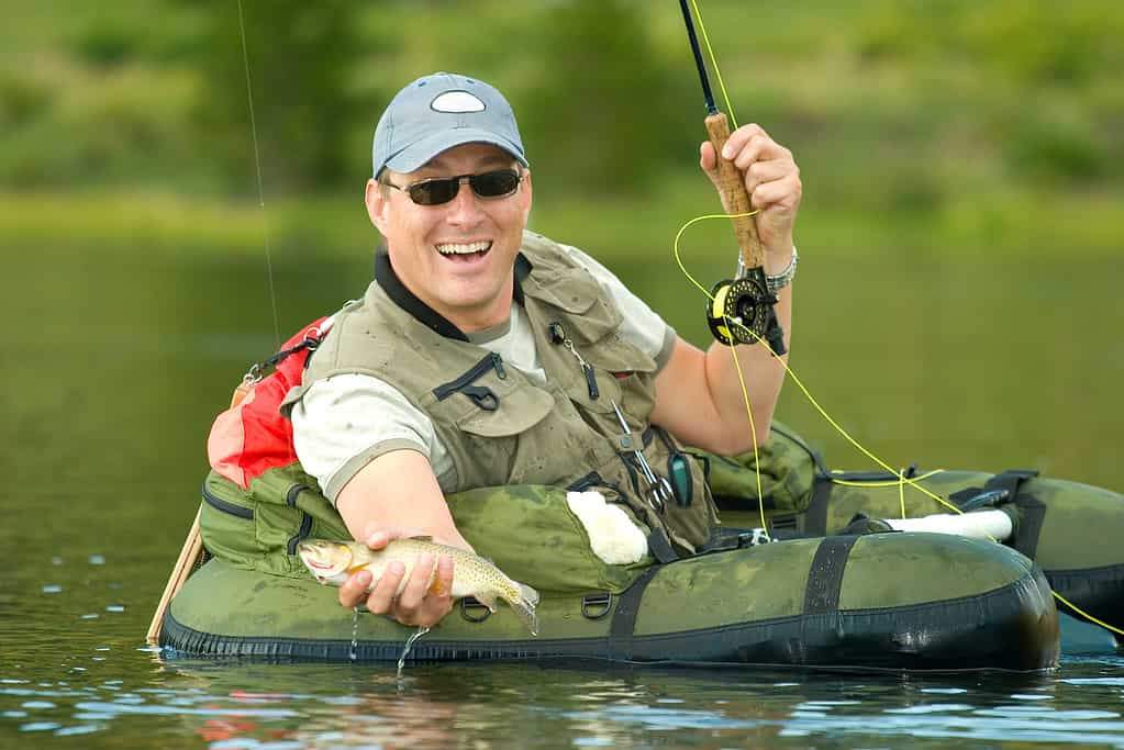 A man fishing in a lake.