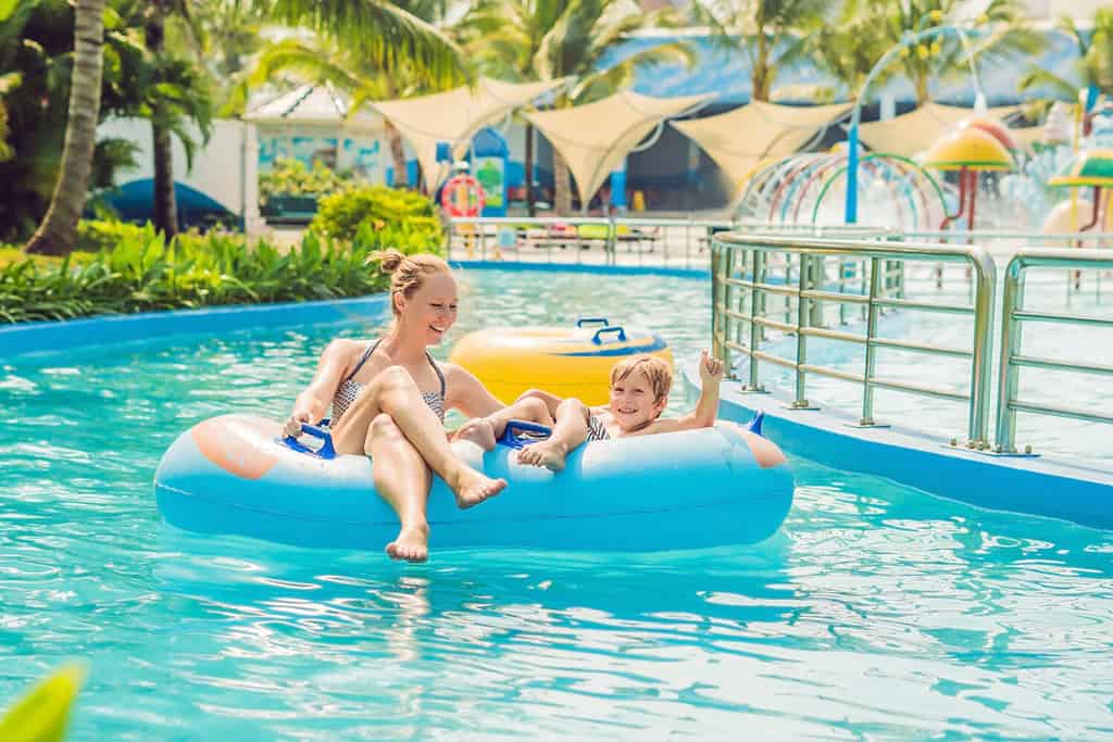 Mom and son have fun at the water park.