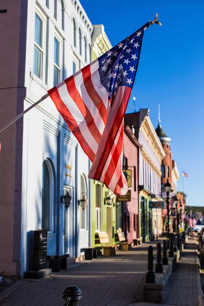 Veterans Day in Leadville Colorado and The American flag, stars and stripes, is flying in the wind