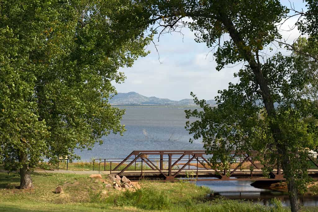 Walking path along the shore of Tom Steed Reservoir inside Great Plains State Park in Oklahoma