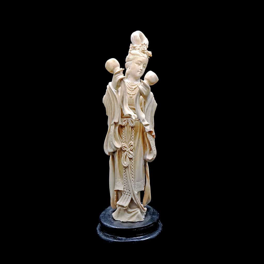 Chinese Ivory carving / sculpture - Chinese ancient women with music instument isolated on white background.