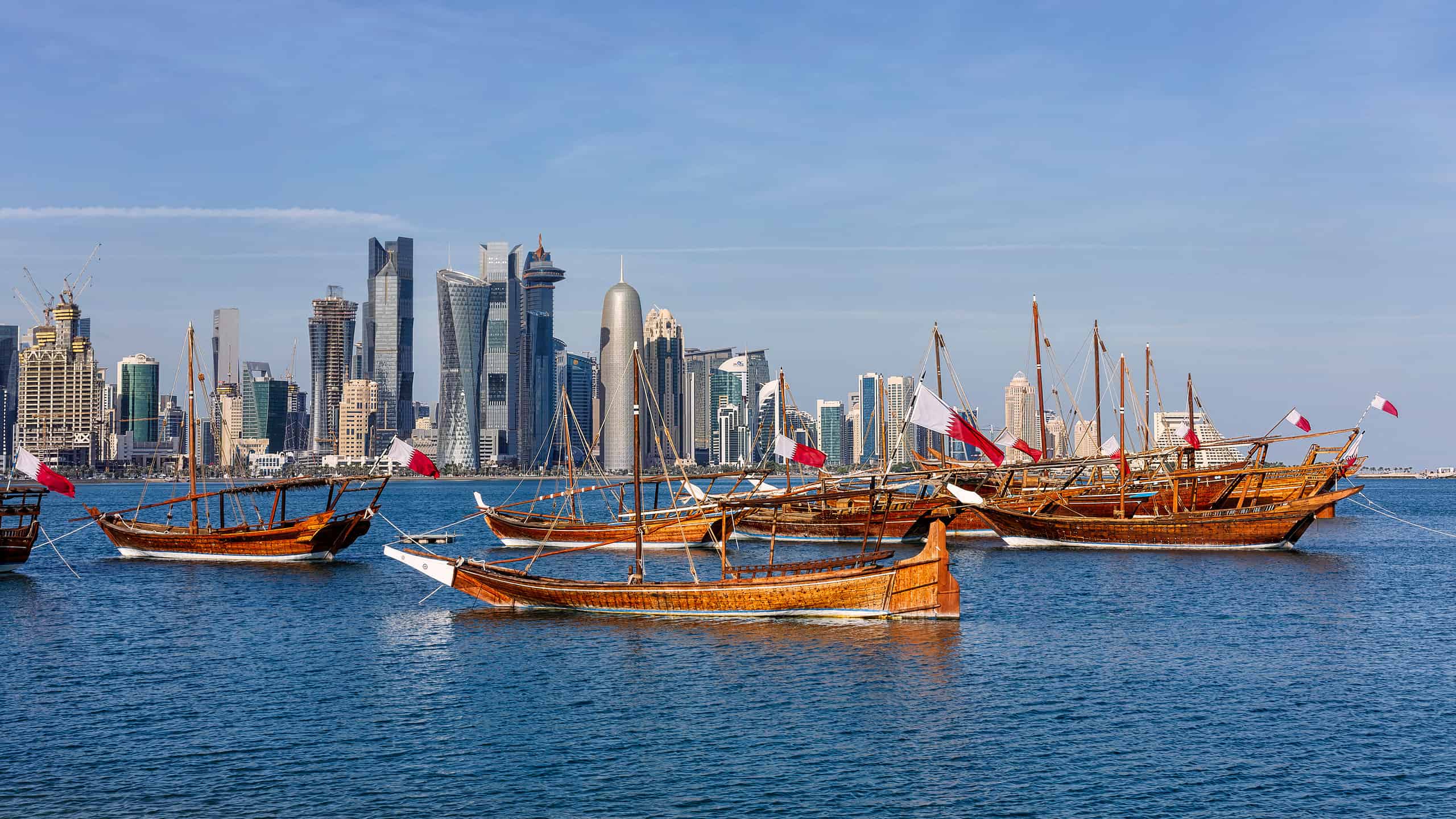 The Flag of Qatar is flown prominently in many public places, including on boats.