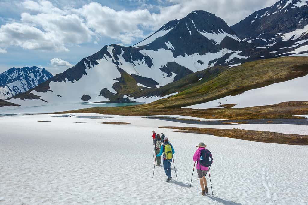 Hiking in a snowfield at Crow Pass in Alaska during June.