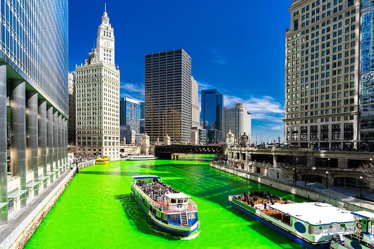 Chicago Skylines building along green dyeing river of Chicago River on St. Patrick's day festival in Chicago Downtown IL USA
