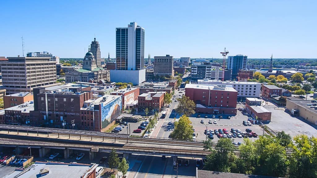 Aerial skyline of downtown Fort Wayne, Indiana featuring train tracks