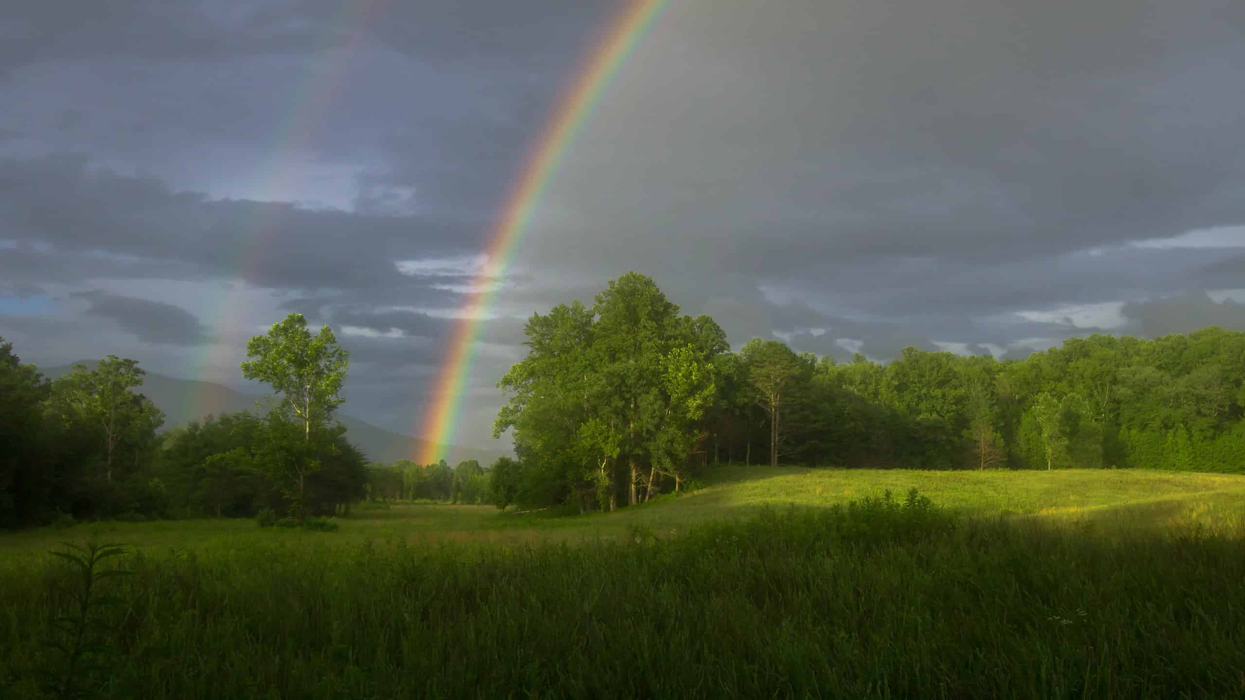 A stunning double rainbow appeared after a rainstorm in Cades Cove in the Great Smoky Mountains National Park.