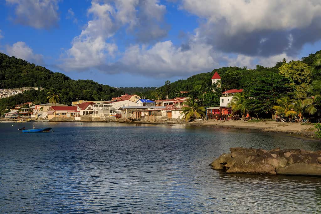Deshaies waterfront bathed in late afternoon sun, the Death In Paradise TV series Saint Marie location, on the island of Basse Terre in Guadeloupe