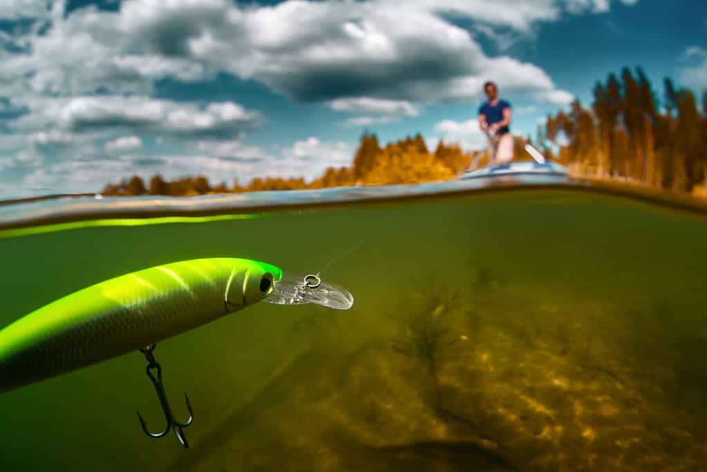 Split shot of the man fishing on the pond with plastic floating bait