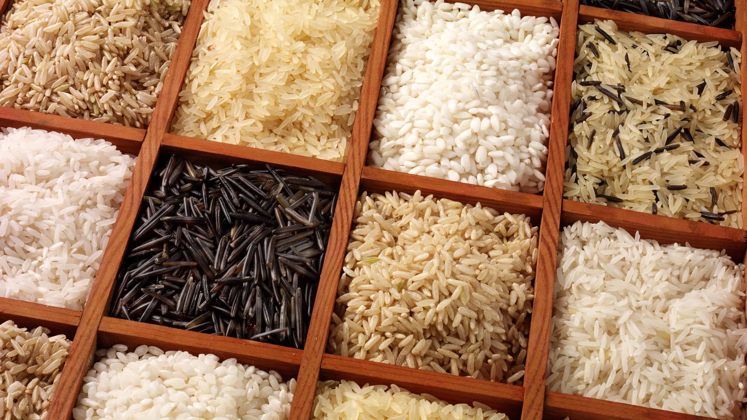 12 different square wooden boxes of different varieties of rice take up the frame.