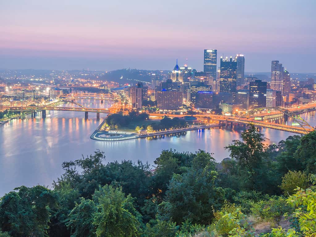 The Allegheny and Monongahela Rivers converge in Western Appalachia to form the Ohio River under the skyscrapers of Pittsburgh.