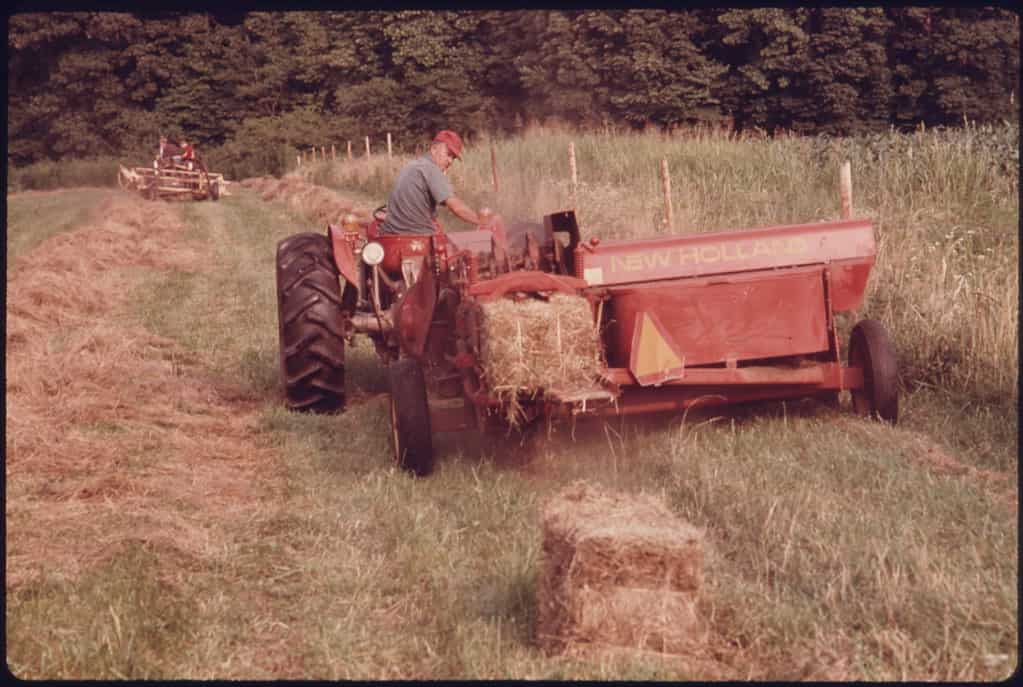 Georgia farmer baling hay, 1975