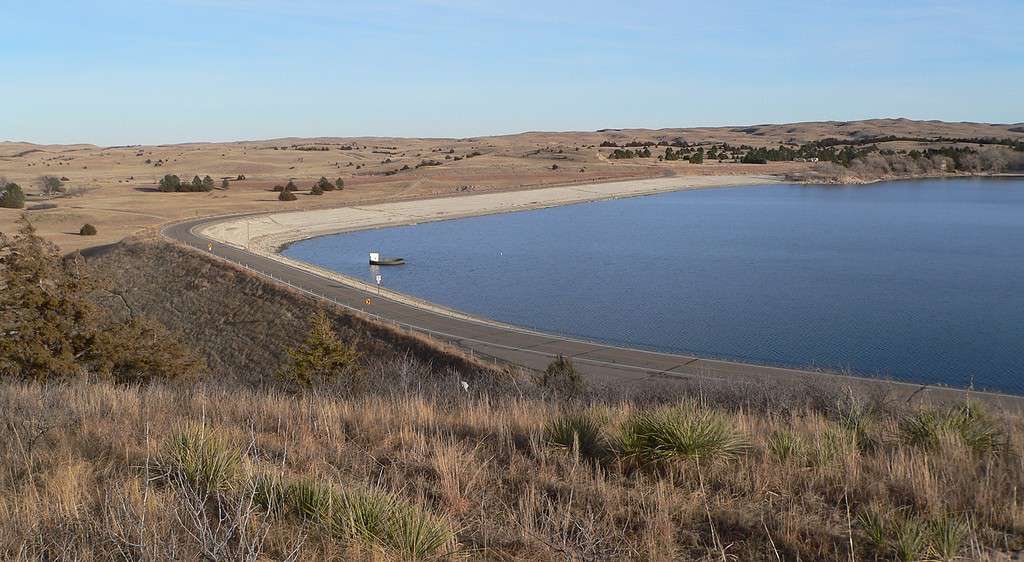 Merritt Dam, located southwest of Valentine in rural Cherry County, Nebraska. View is from the west. Note the bell-mouth spillway at left.