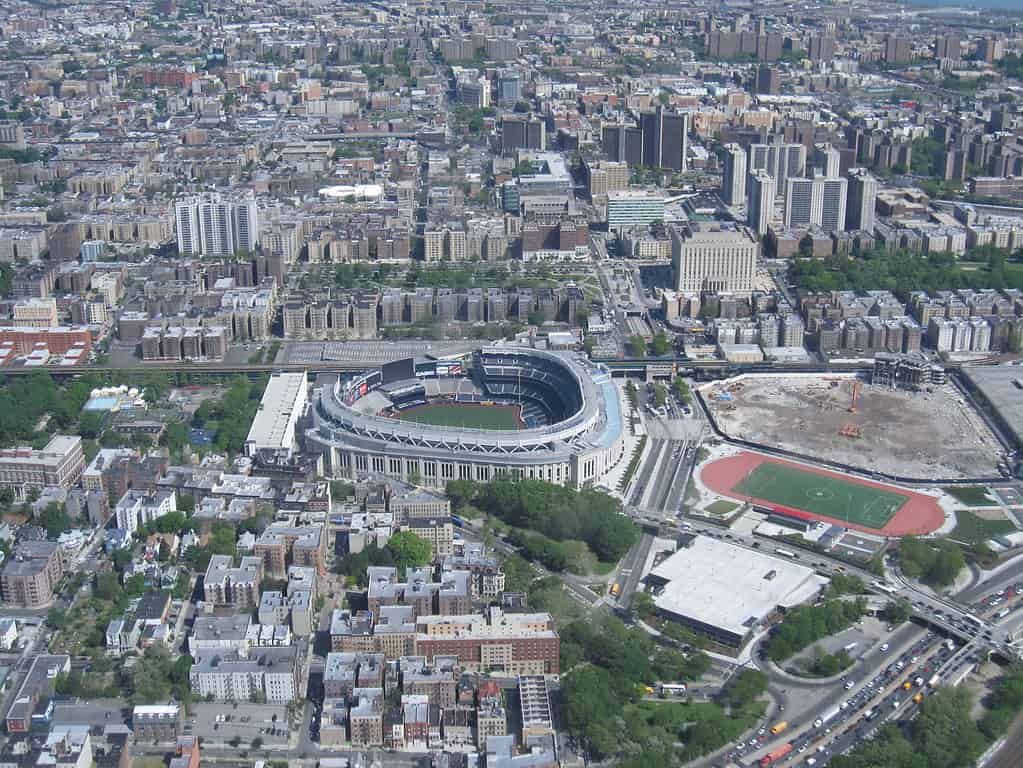 Yankee Stadium (center), Bronx County Courthouse and the Grand Concourse (towards the top), and the site of Yankee Stadium's predecessor to the far right.