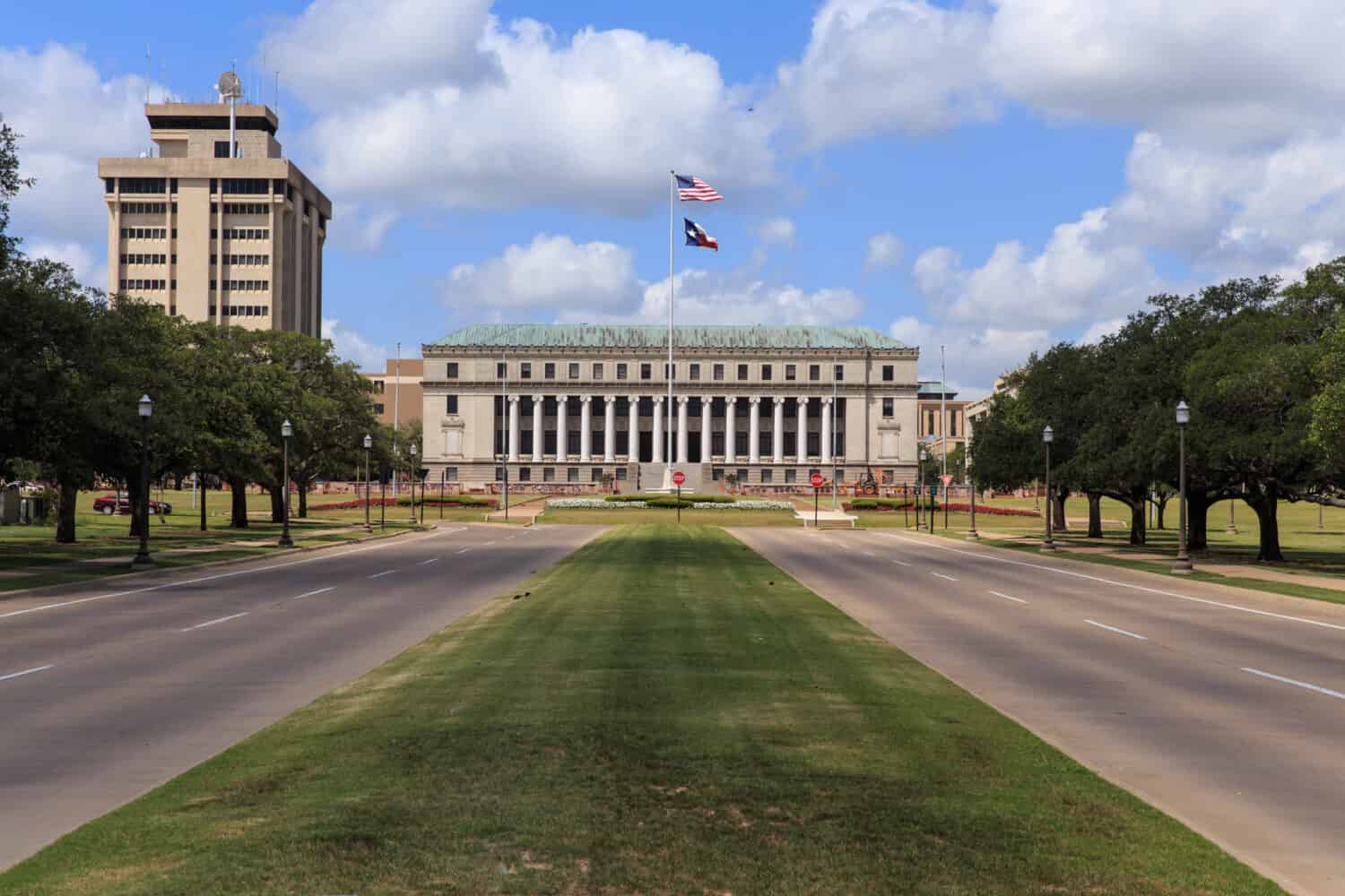 The main entrance to Texas A & M University with the Jack K. Williams Systems Administration building at the end of road in College Station, Texas