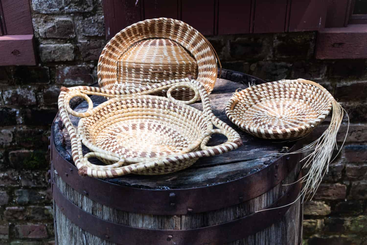 A photo of hand-made sweetgrass baskets made in the Gullah-Geechee style of Lowcountry, South Carolina.