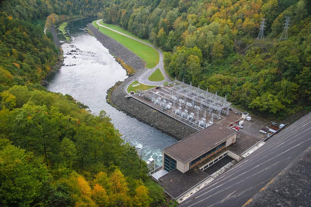 This is the Fontana Dam, at 480 ft. near Bryson City, NC, at the southern border of Smoky Mts. NP. When it was built in the 1940's, it was the highest dam in the Eastern US. Autumn colors frame image.