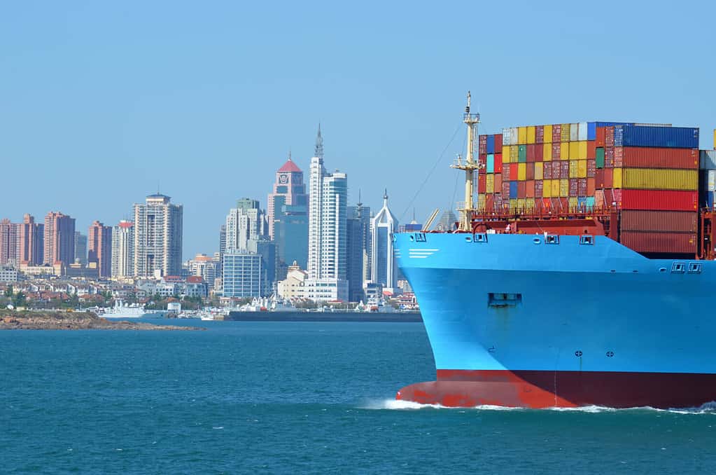 Container ship arriving to the port of Qingdao in China.