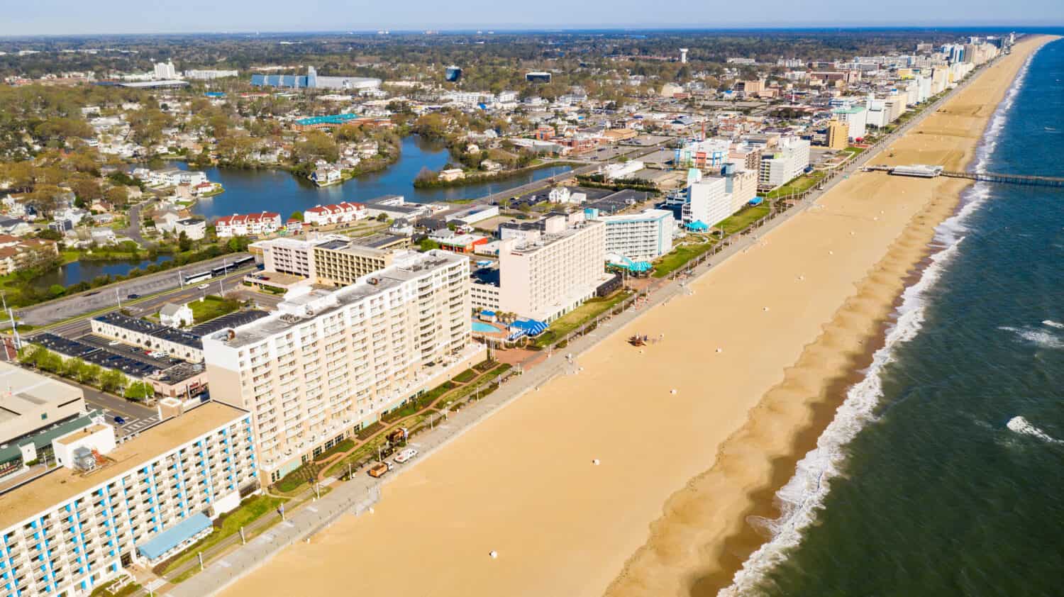 High aerial view of a long row of hotels along the Atlantic Ocean beach in Maryland USA