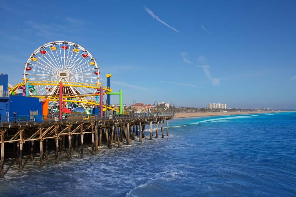 Santa Monica pier Ferris Wheel in California USA on blue Pacific Ocean