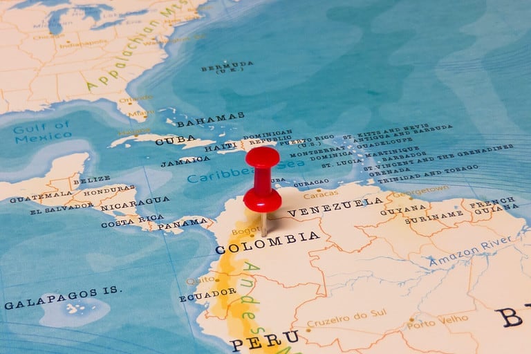 A Red Pin on Colombia of the World Map