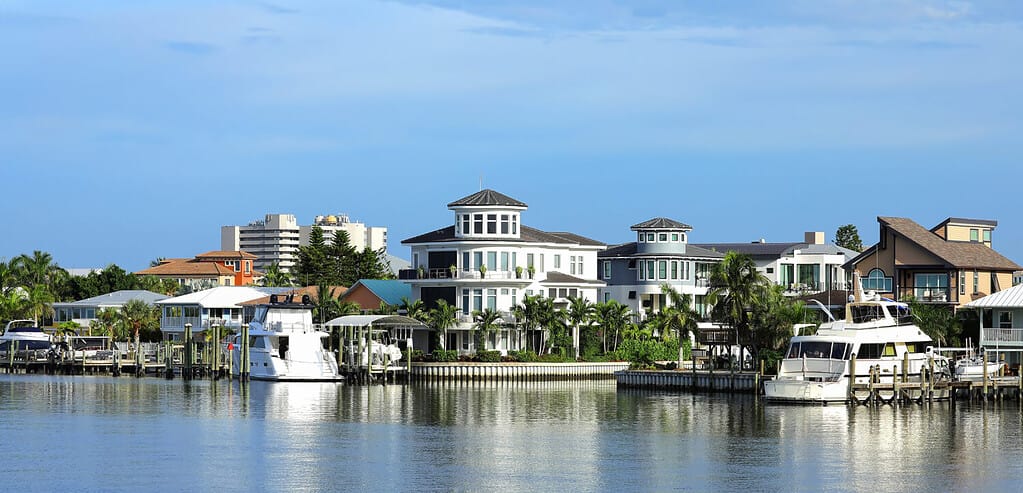 Waterfront homes, timeshares and condos along Matanzas Pass waterways, steps away from Times Square in Fort Myers Beach, Florida, USA.