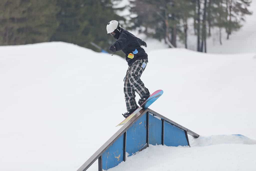A snowboarder on a ramp