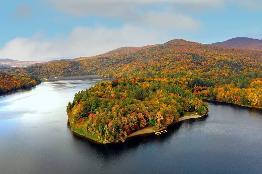 Colorful aerial view of Waterbury Reservoir near in Waterbury Vermont during the fall.