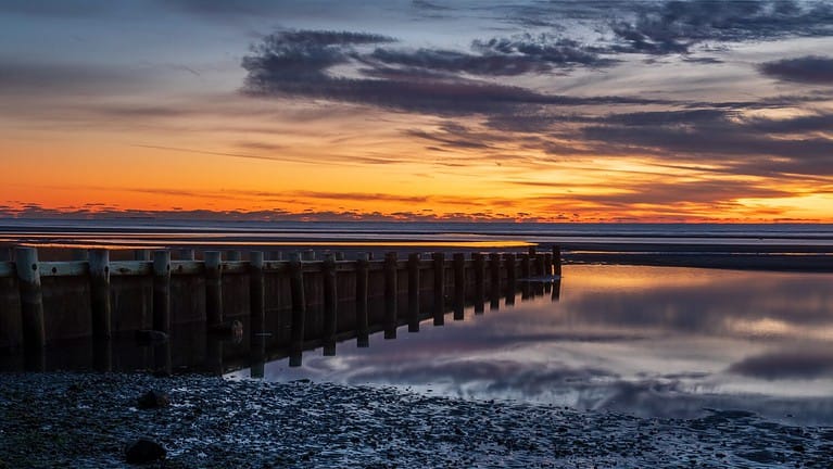 Harveys Beach in CT at Sunset. Taken in winter just after sunset on a Long Island Sound beach with a huge tidal change.