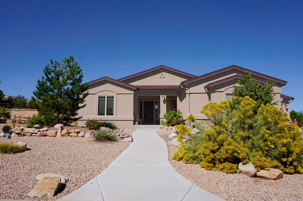 Streetview of a suburban home with xeriscape landscaping.
