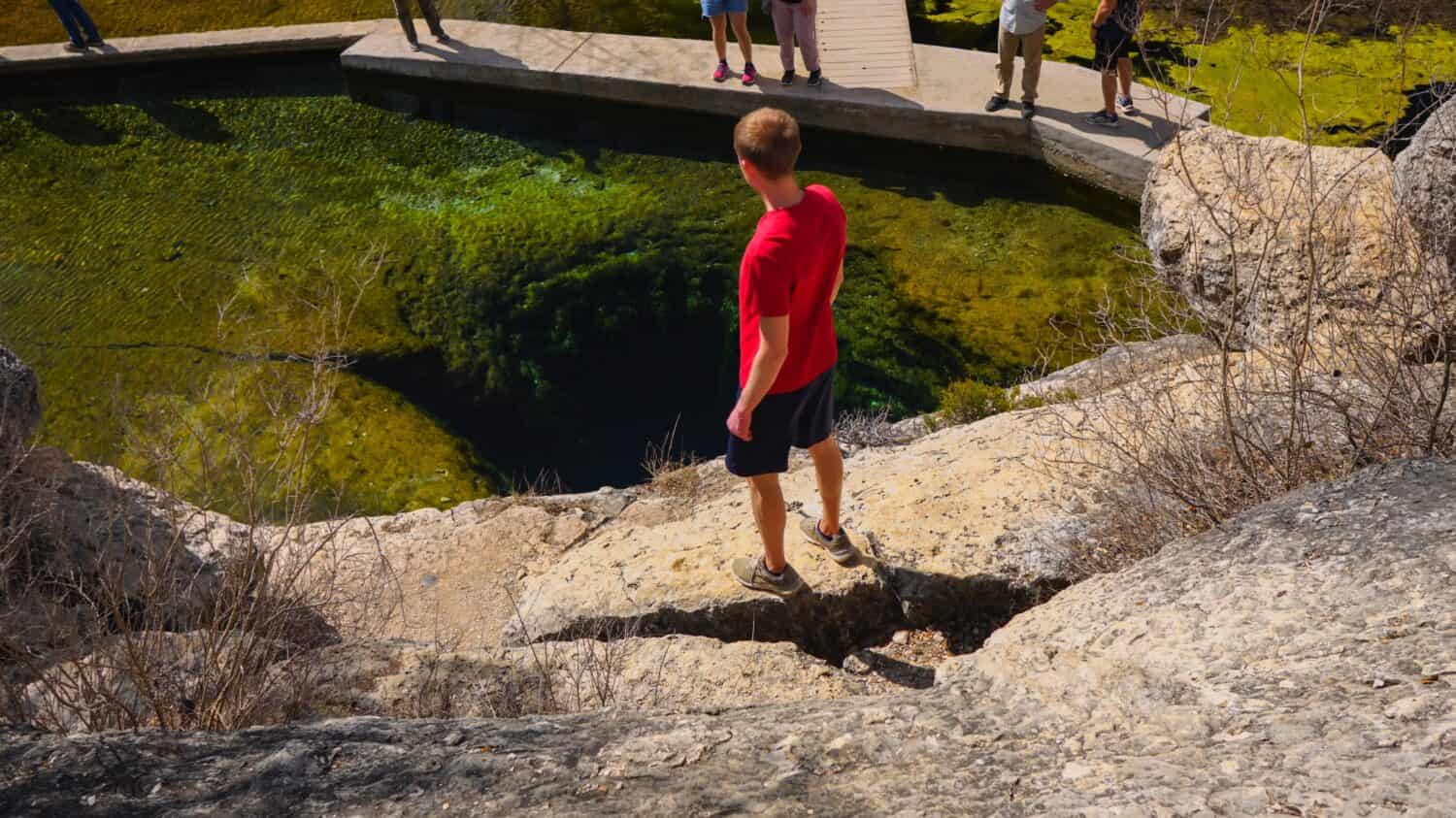Hiker at Jacob’s Well in Wimberley, TX