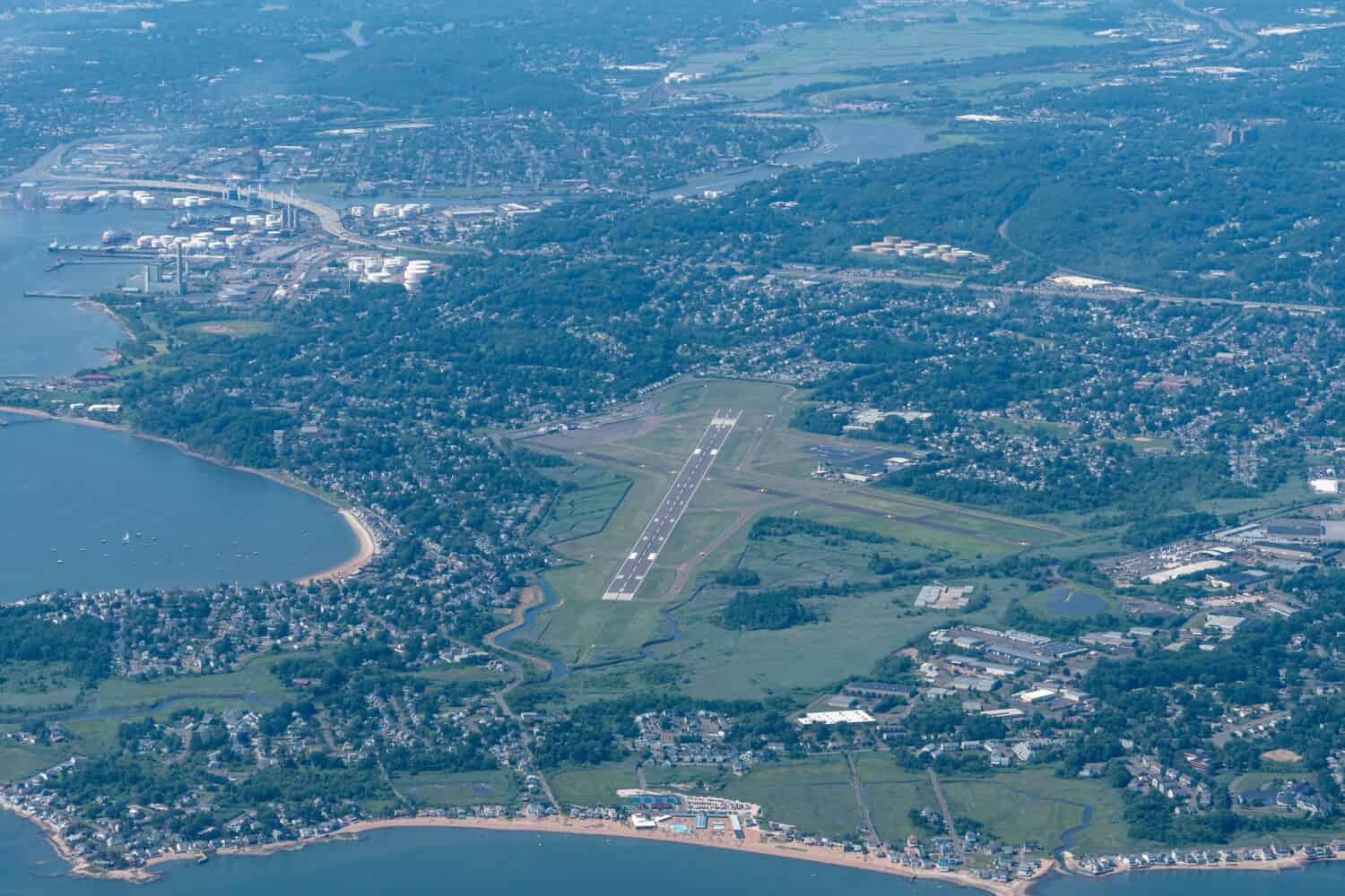 Flying over New Haven's airport in Connecticut. Aerial view from the Long Island Sound, showing one closed runway.