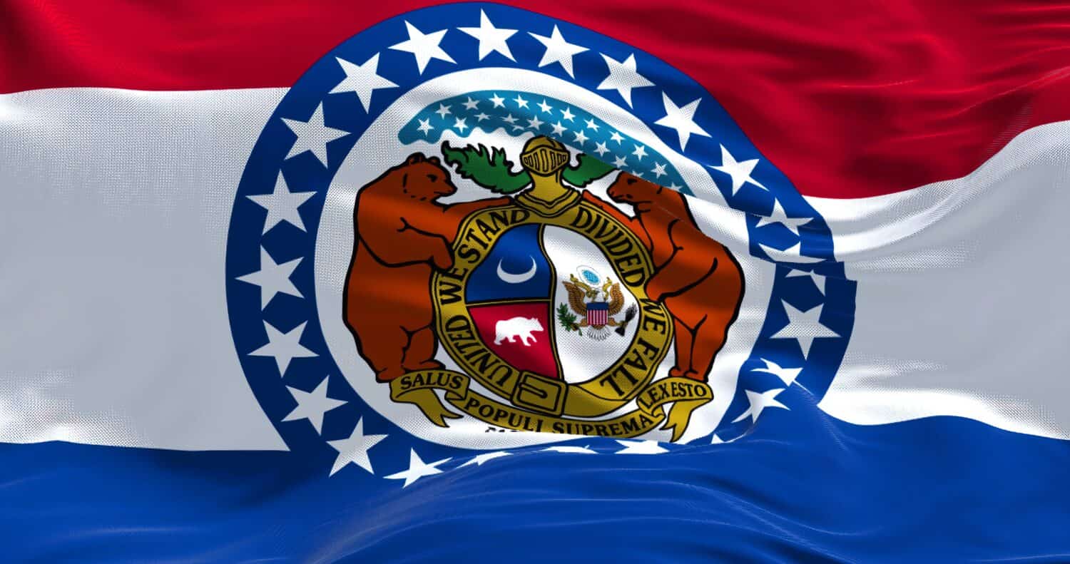 The US state flag of Missouri waving in the wind. Missouri is a state in the Midwestern region of the United States. Democracy and independence.
