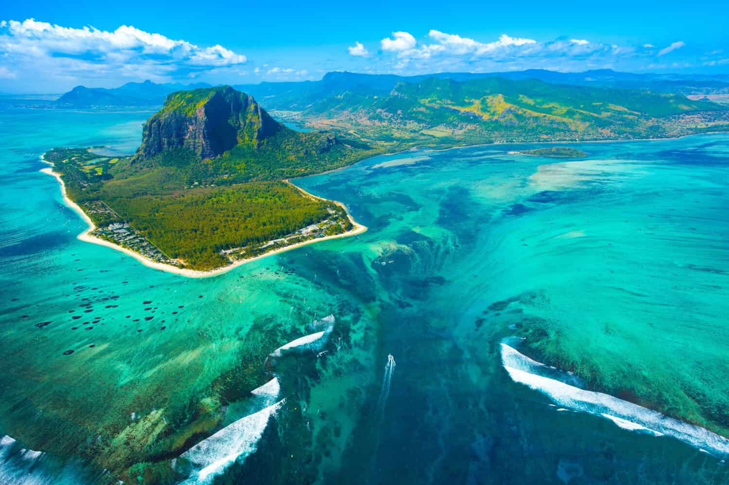 Aerial view of Mauritius island and Le Morne Brabant mountain with beautiful blue lagoon and underwater waterfall illusion 