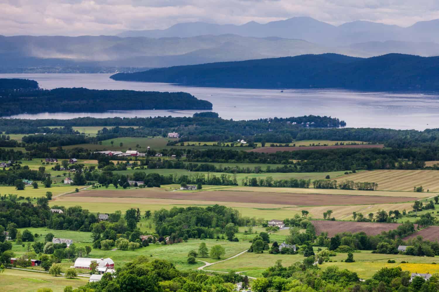 Horizontal Vermont Countryside scene looking towards Lake Champlain and the Adirondack Mountains. The shot was taken from Mount Philo State Park