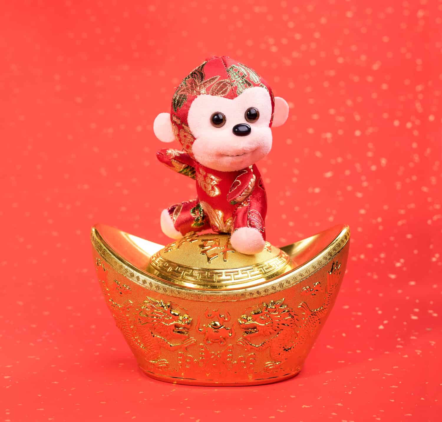chinese monkey toy on red background