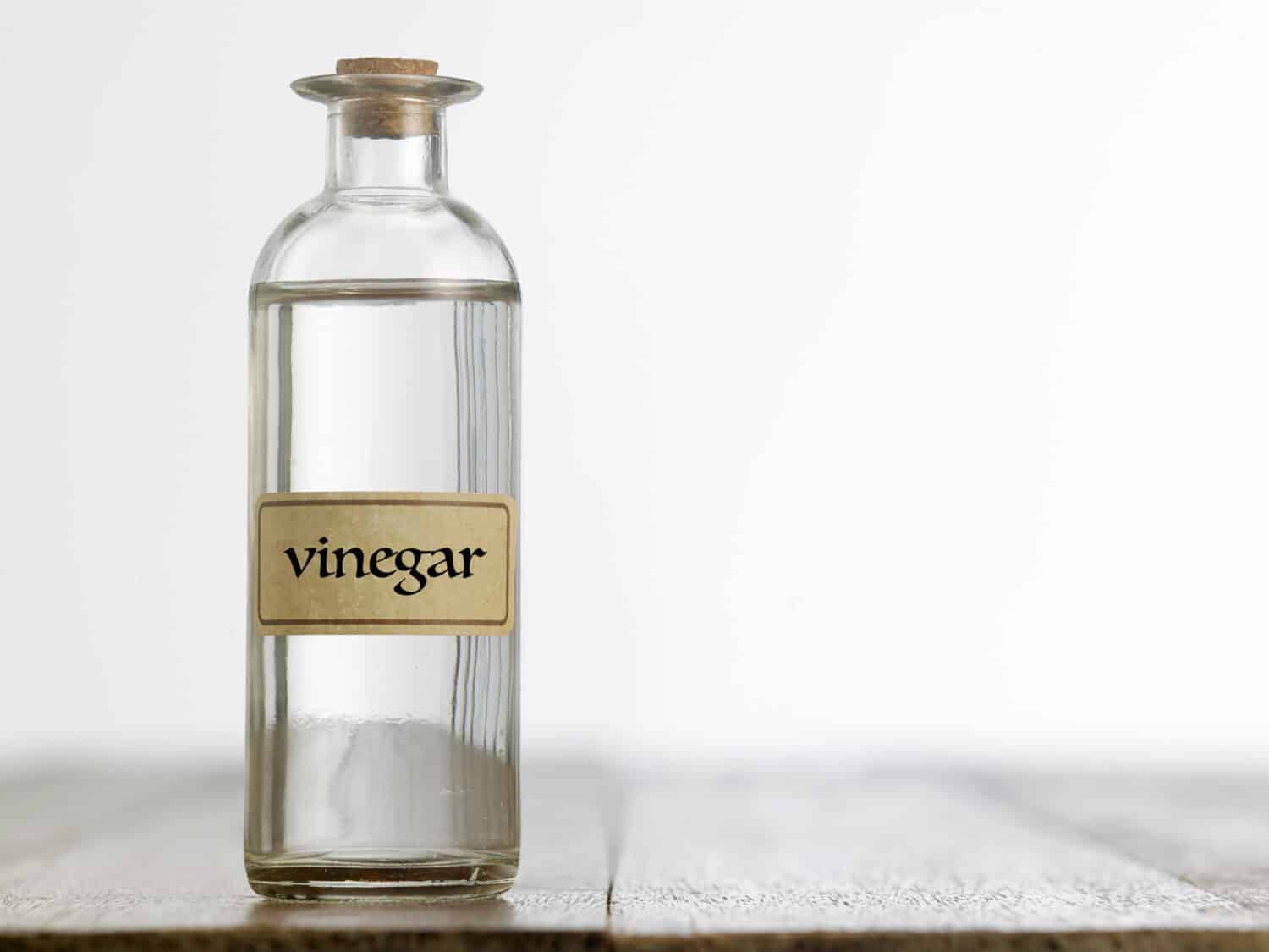 white vinegar on the wooden table top