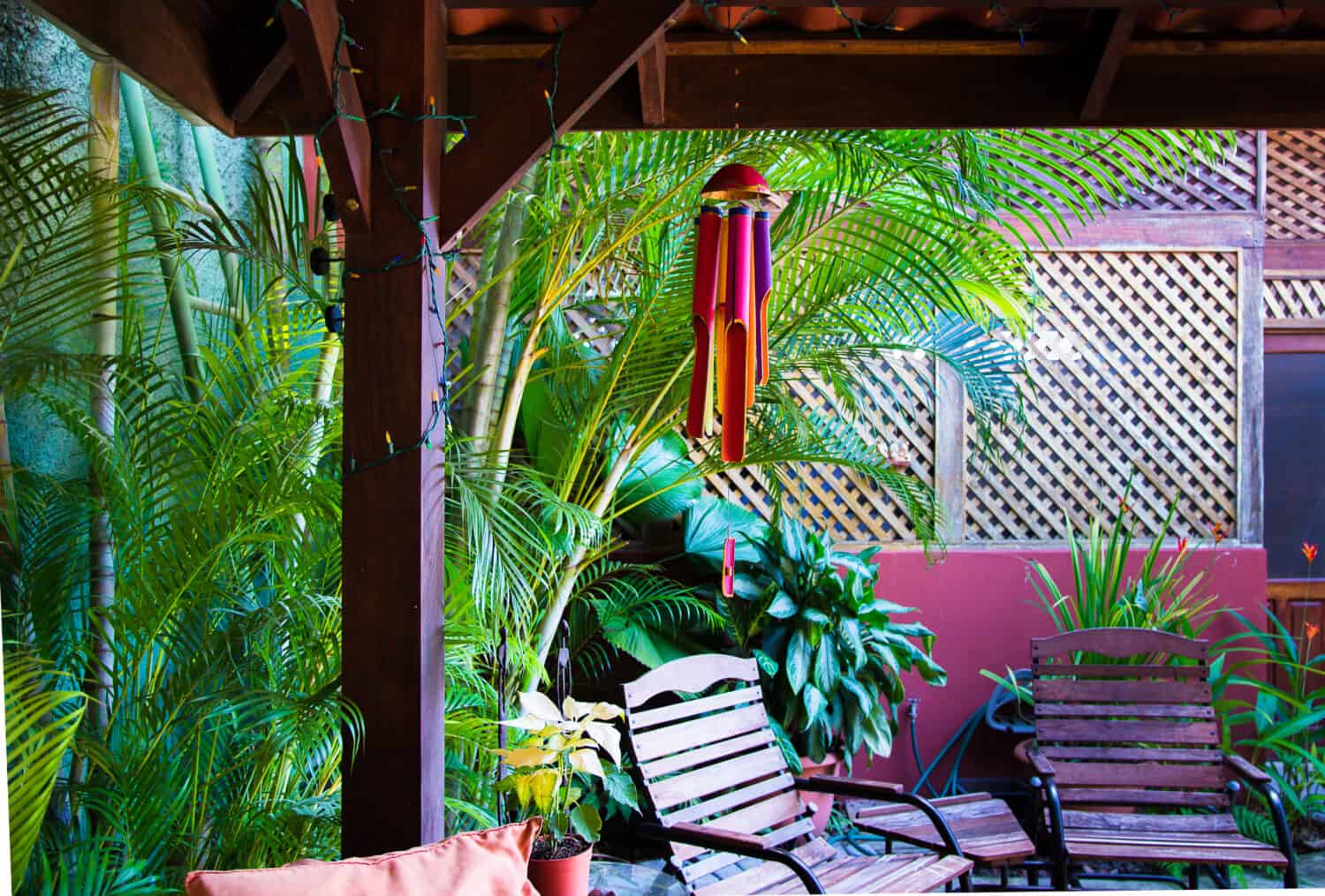 Backyard, tropical pergola. Full color bamboo wind chime.