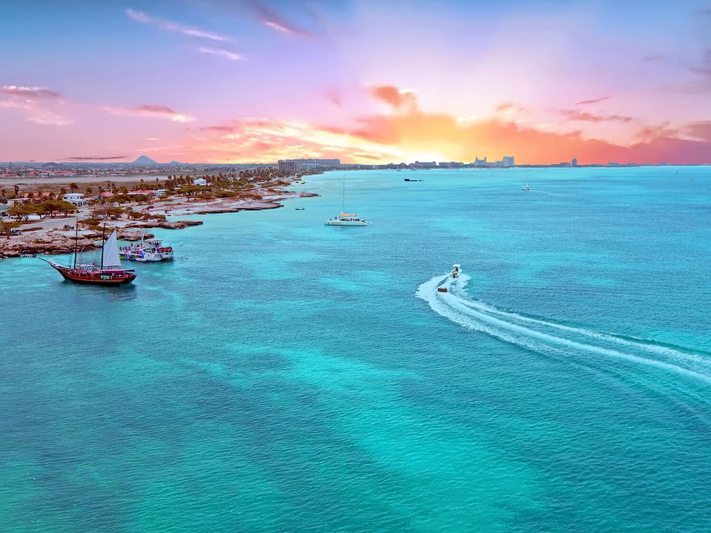 An aerial view of the island of Aruba in the Caribbean Sea at sunset