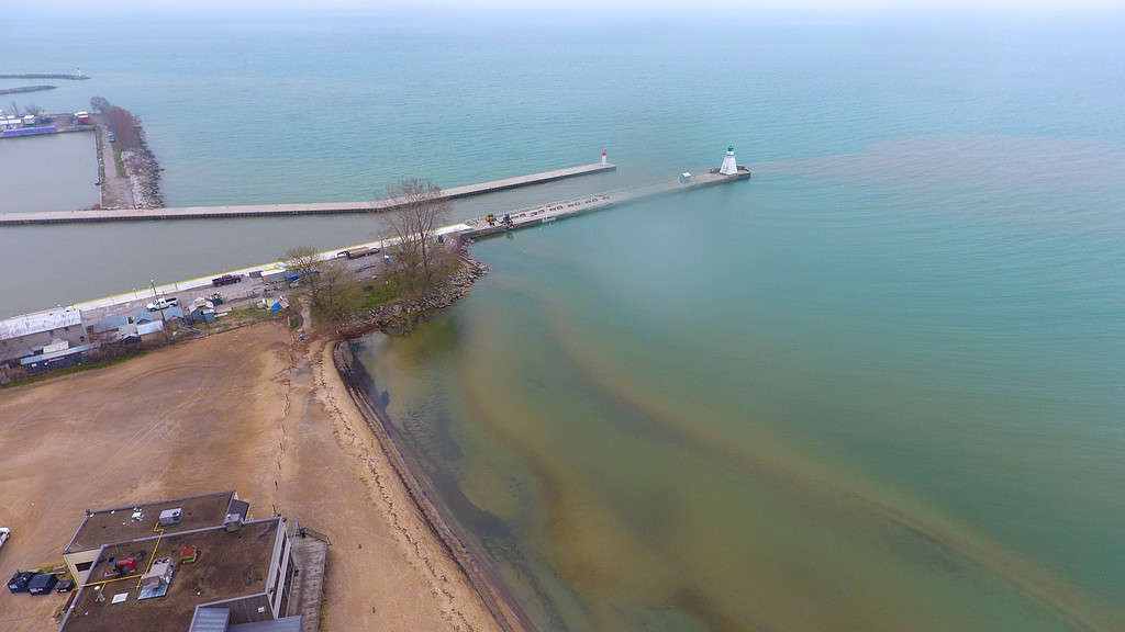 Aerial view of oil contaminated water pollution being released into Lake Erie from the steel mills in Nanticoke, seen at the beach at the shore of Port Dover, Ontario.