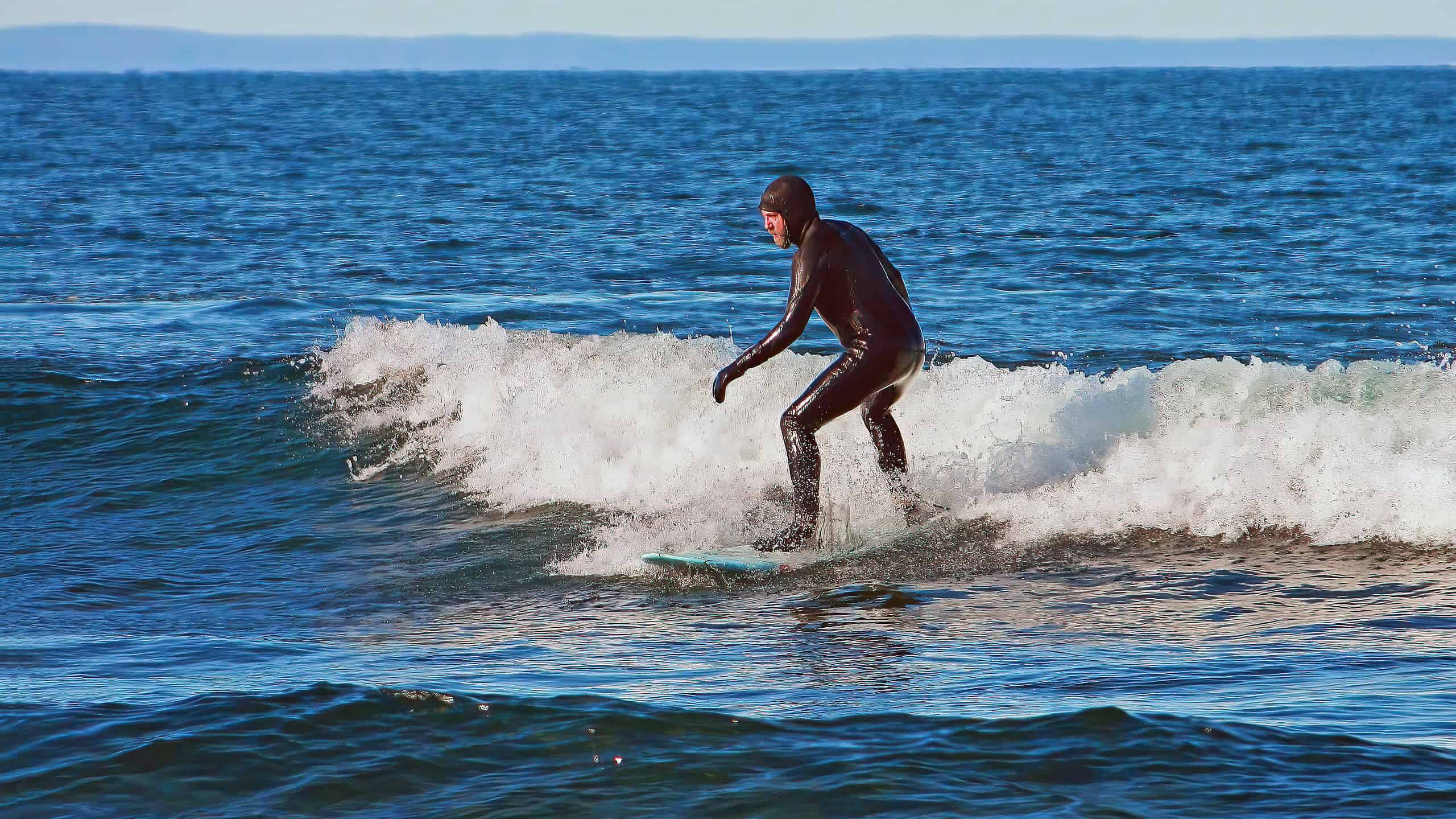 Duluth, Minnesota USA March 2, 2013 Surfer on Lake Superior near Duluth, Minnesota in the winter in the month of March.