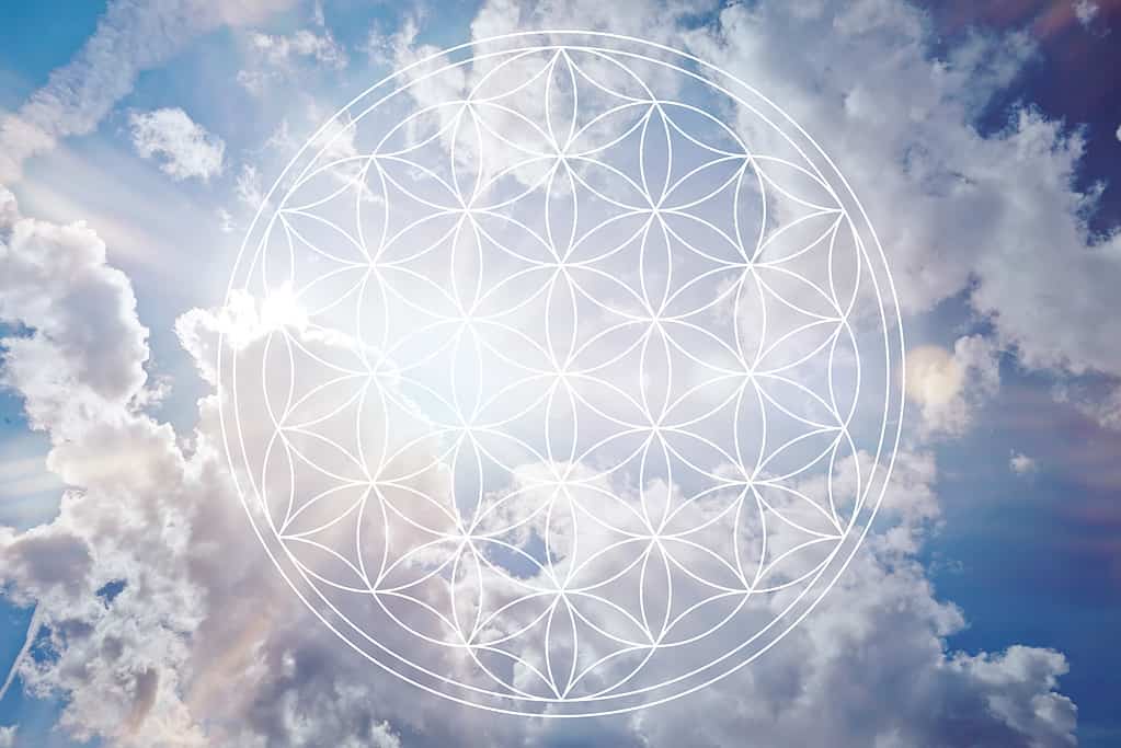 Flower of life in the sky as holistic reiki sign.