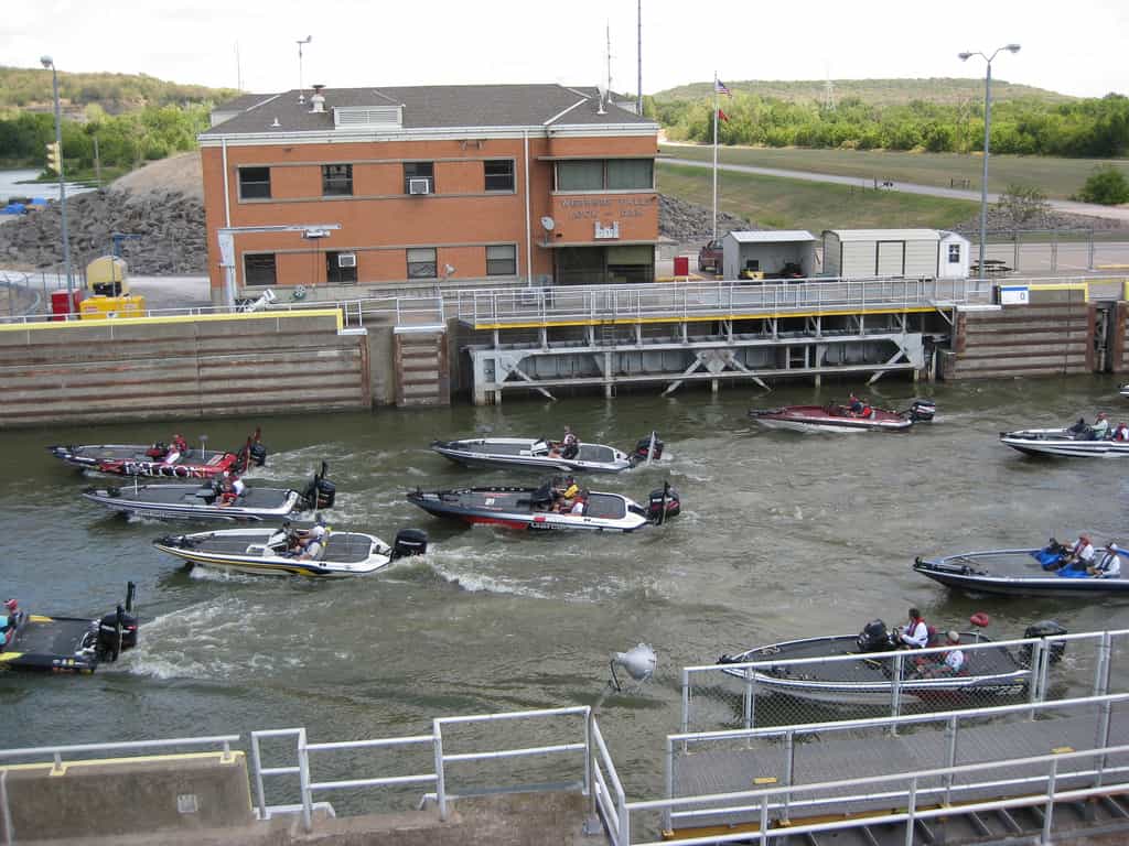 isherman participating in the Bassmaster’s Central Open professional fishing tournament lock through Webbers Falls Lock and Dam on their way to the daily weigh-in at Three Forks Harbor Marina.