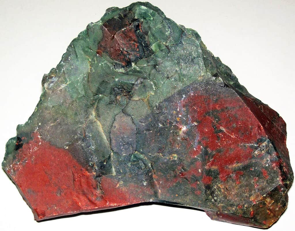 Heliotrope, or bloodstone, is a dark green to dark bluish-green gemstone