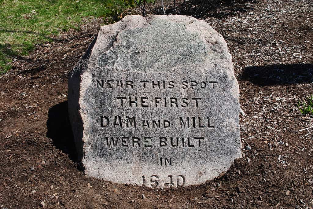 A stone marking the location of the first mill built on Mother Brook in Dedham, Massachusetts.