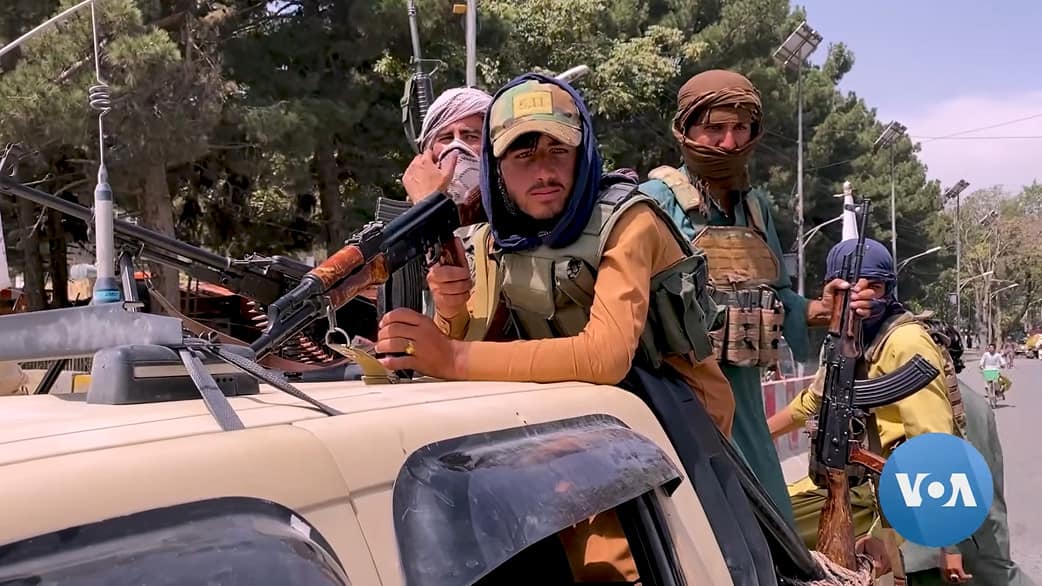 Taliban fighters and truck in Kabul, Afghanistan, August 17 2021