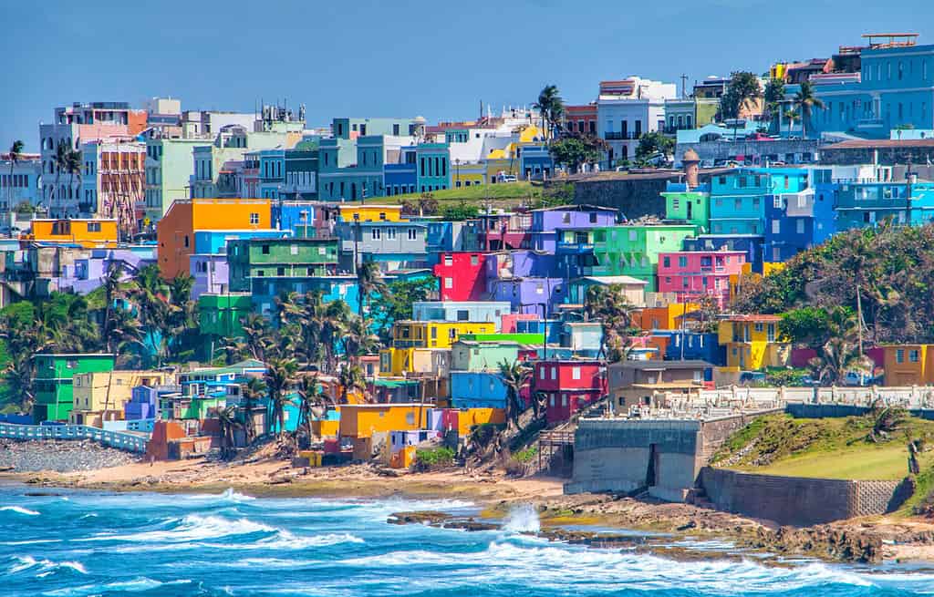 Colorful houses line the hillside over looking the beach in San Juan, Puerto Rico