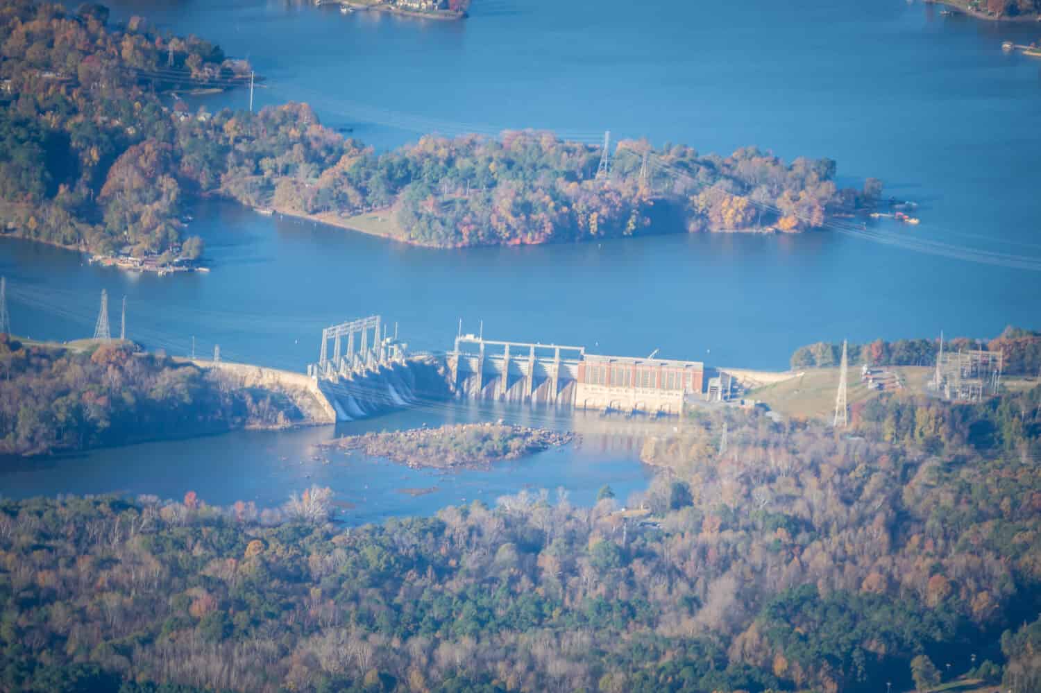 aerial from an airplane over hydro power energy plant and dam