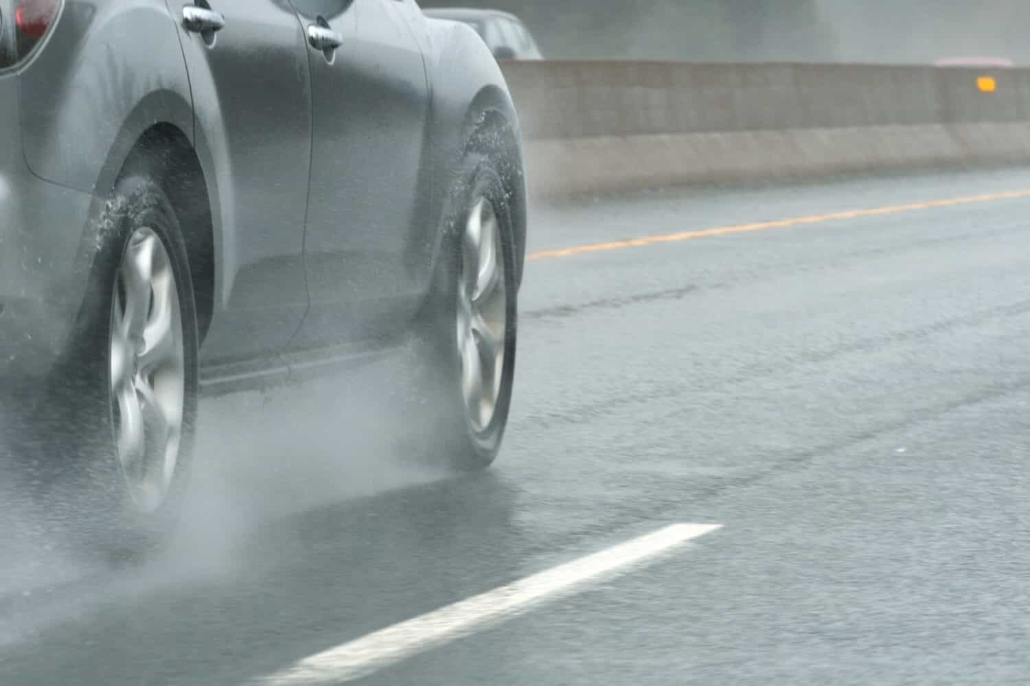 Car on Highway During Rain Storm Close Up Abstract